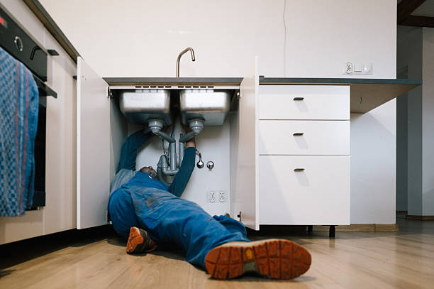 Professional Emergency Plumber technician working in Caldwell, TX